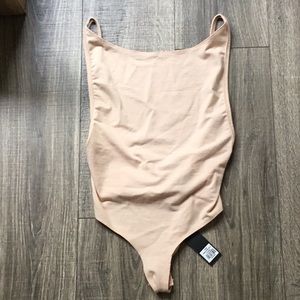 Peach, backless thong-snapped bodysuit